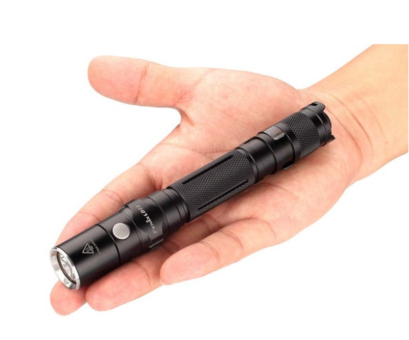 Fenix LD22 V2 Flashlight on palm of hand.