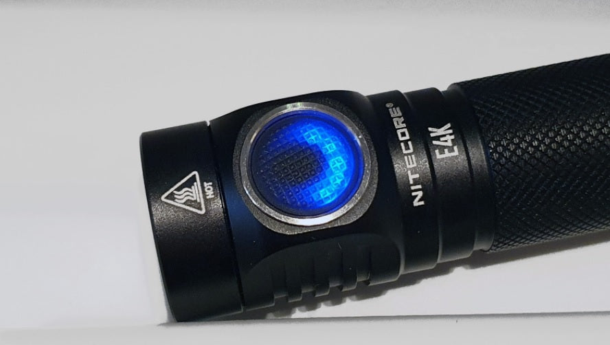NITECORE E4K Next Generation 21700 Compact EDC Flashlight with lighted side switch.