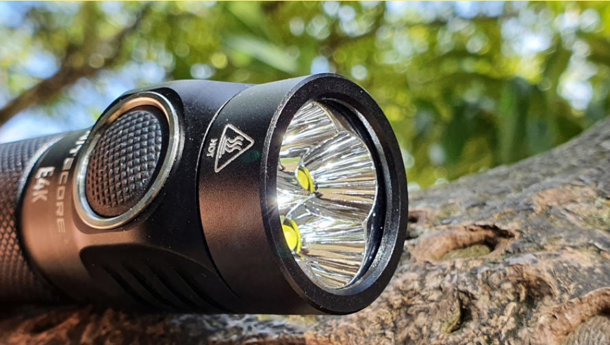 NITECORE E4K Next Generation 21700 Compact EDC Flashlight with smooth reflector.