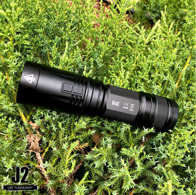Nitecore R40 1000 Lumens Rechargeable LED Flashlight with charging dock.