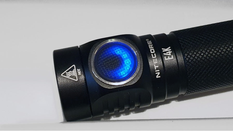 NITECORE E4K Next Generation 21700 Compact EDC Flashlight with lighted side switch.